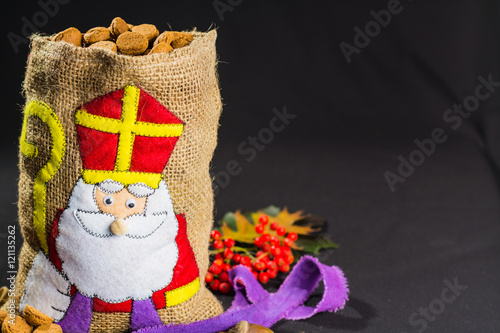 St. Nicholas' bag for children filled with traditional Dutch  spicy cookies © barmalini