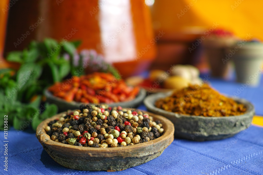 Collection of different spices in old clay bowls in colorful oriental style Collection of different spices in old clay bowls in colorful oriental style