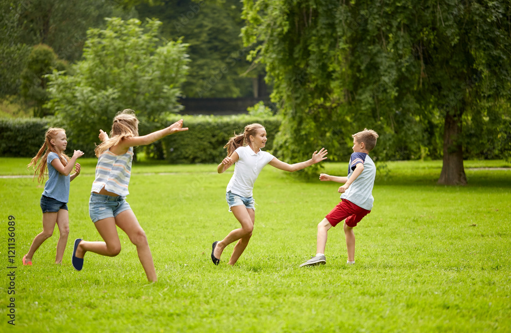 happy kids running and playing game outdoors happy kids running and playing game outdoors