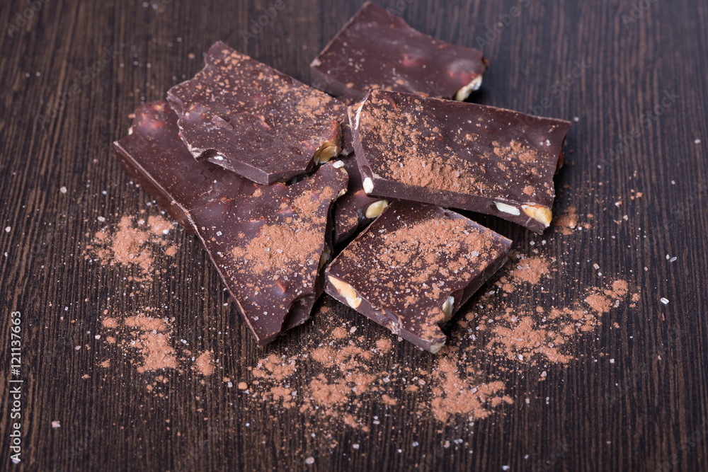 pieces of dark chocolate with cocoa powder Stock Photo Adobe Stock