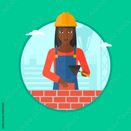 Bricklayer with spatula and brick.