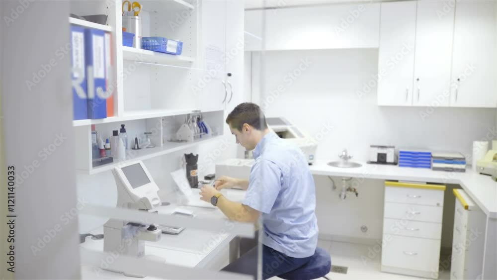 Person work at Optometrist laboratory 4K Person work at Optometrist laboratory 4K
