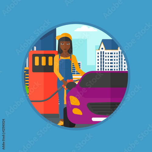 Worker filling up fuel into car.