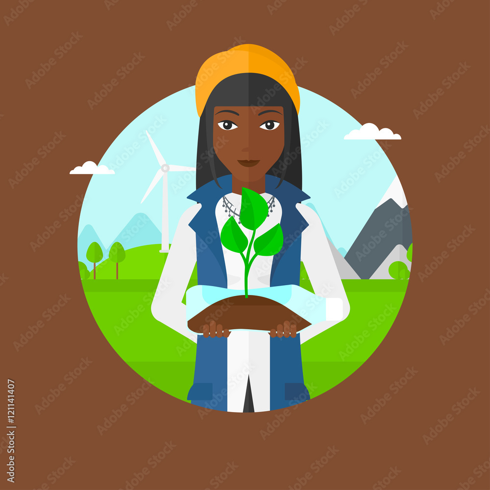 Woman holding plant growing in plastic bottle. Woman holding plant growing in plastic bottle.