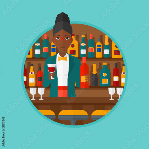 Bartender standing at the bar counter.