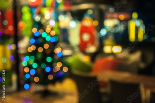 Wallpaper Mural Color photo of blurred Christmas decorations on wooden background. abstract background to time for Christmas holiday. Torontodigital.ca
