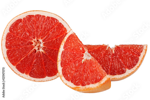 grapefruit and two slices on a white background