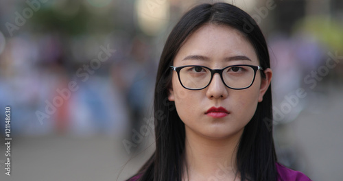 Young Asian woman in city face portrait