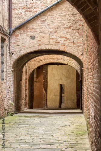 alley with arcade in the historic center of a city