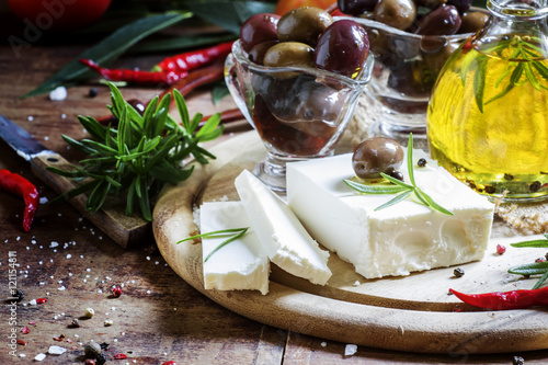 Soft greek feta cheese with rosemary, olives and butter, selecti