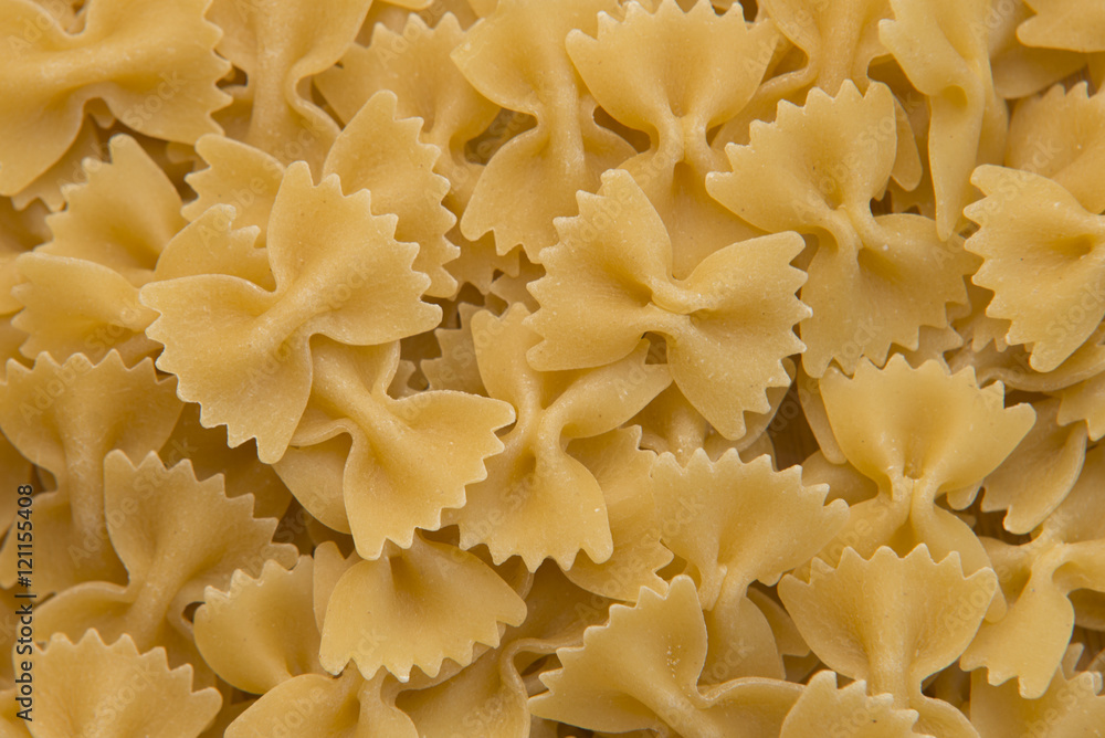 Closeup of uncooked italian pasta - farfalle Closeup of uncooked italian pasta - farfalle