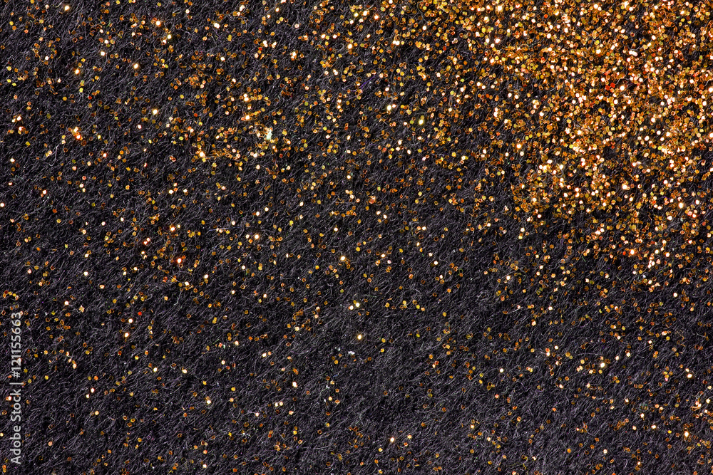 Gold glitters on black felt Gold glitters on black felt