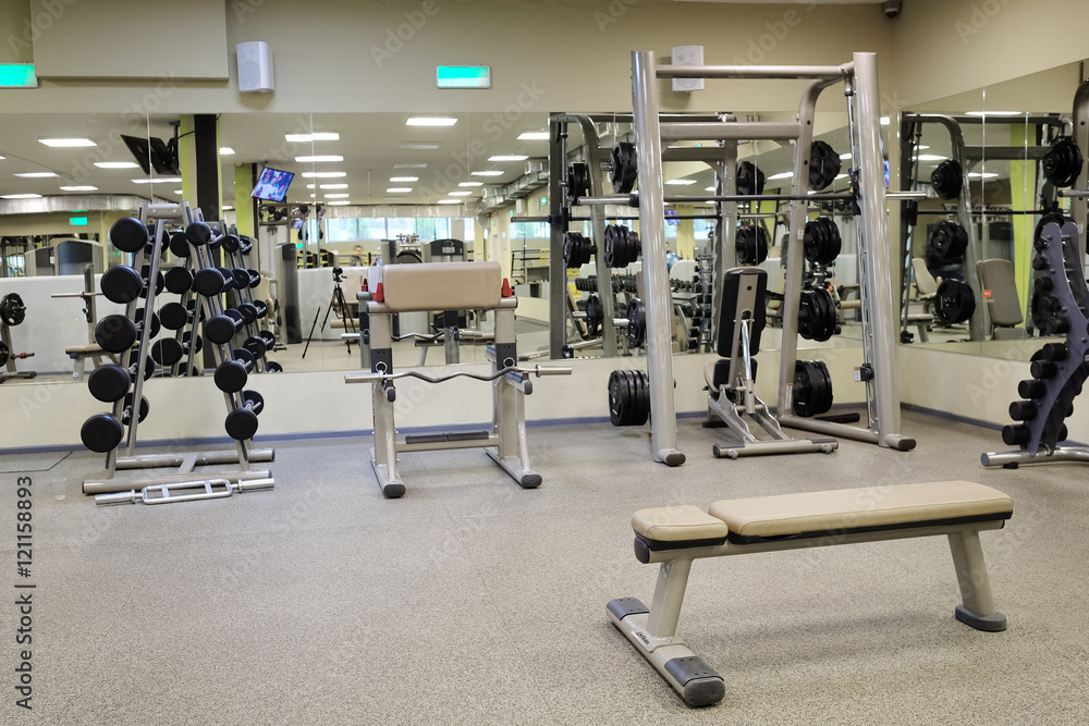 Interior of a fitness hall with wights and other sport equipment