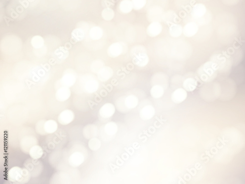 Vector bokeh background. Festive defocused white lights. Abstract blurred illustration.