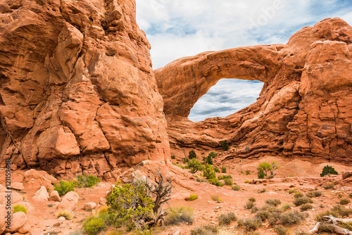 One window arch in national park with cloudy sky