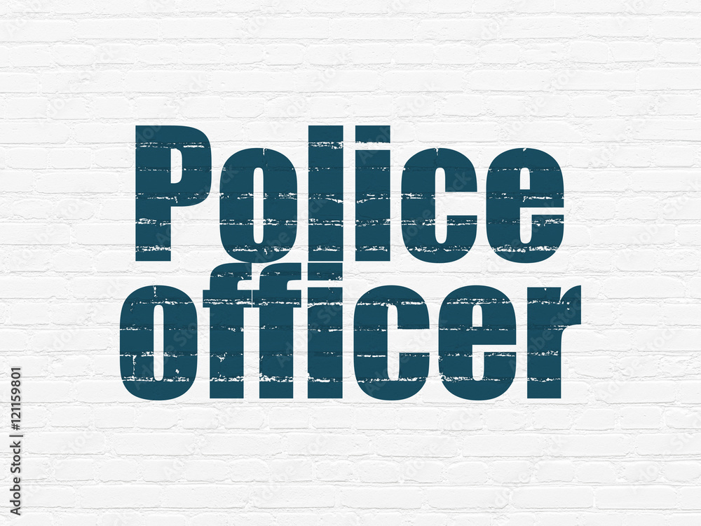 Law concept: Police Officer on wall background Law concept: Police Officer on wall background