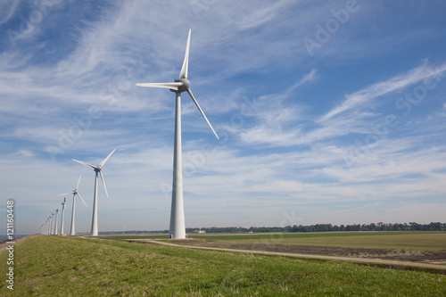 Row of windturbines at the IJsselmeer in the Netherlands © esbobeldijk