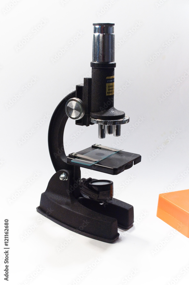 The microscope on a white background. The microscope on a white background.