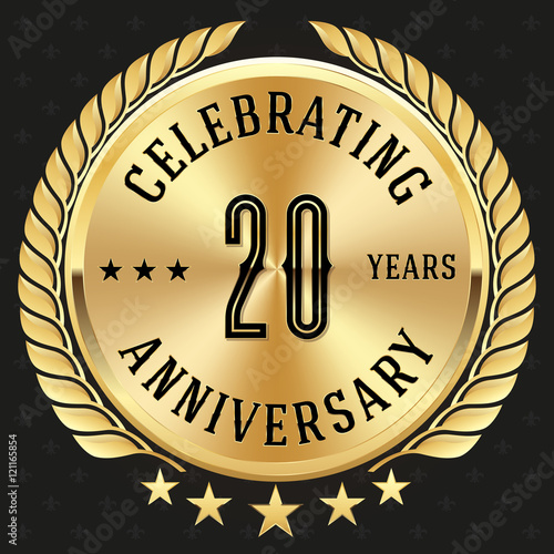 Gold celebrating 20 years badge, button on black background