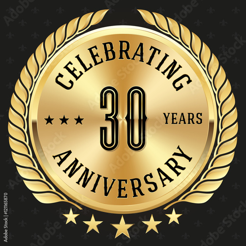 Gold celebrating 30 years badge, button on black background