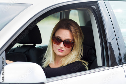 young blonde woman driver in her  car © ctvvelve