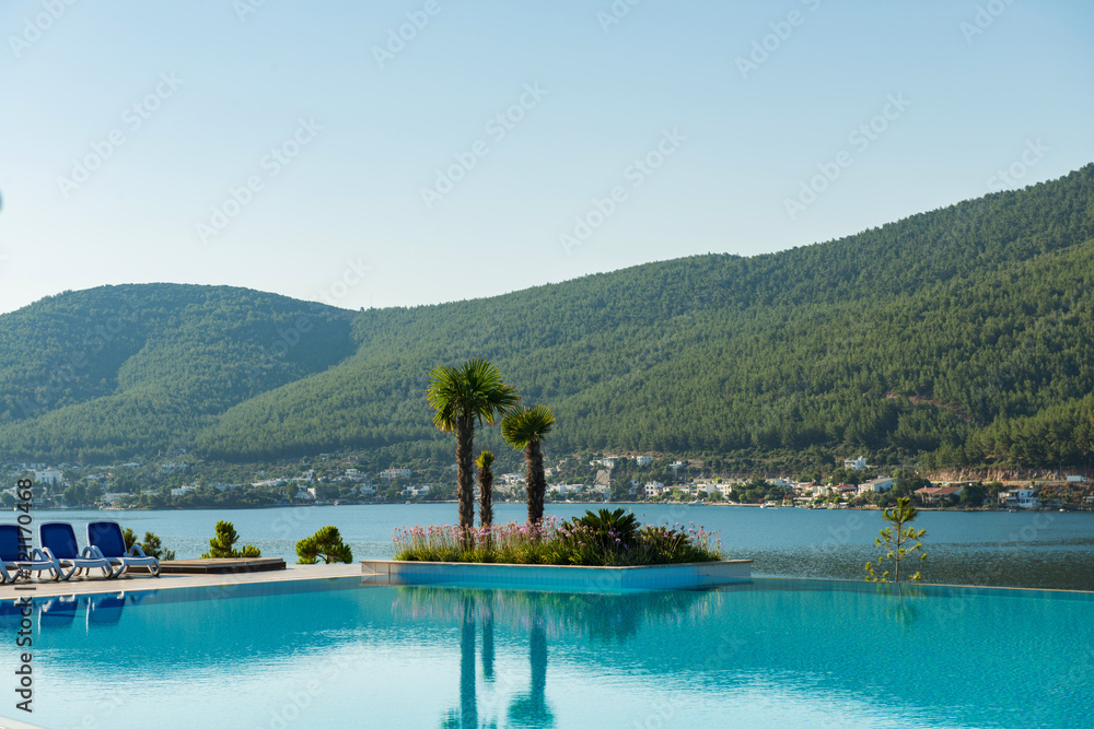 Nice swimming pool outdoors on bright summer day