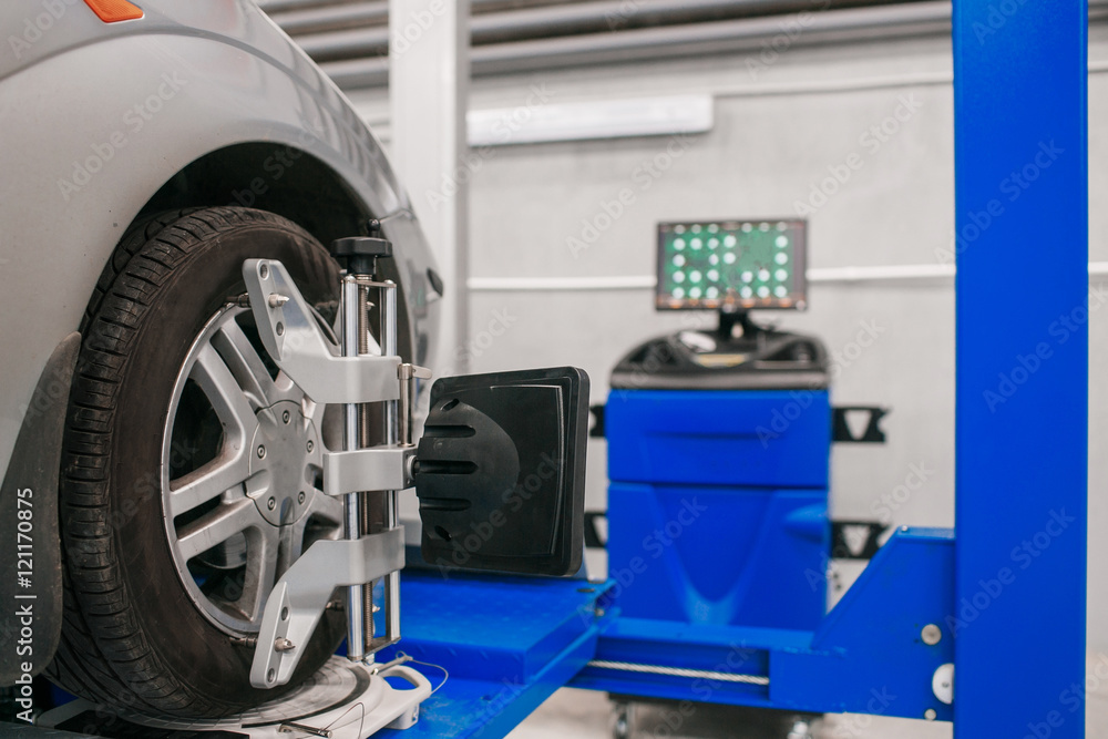 Car on stand with sensors wheels for alignment camber check in workshop of Service station. Car on stand with sensors wheels for alignment camber check in workshop of Service station.