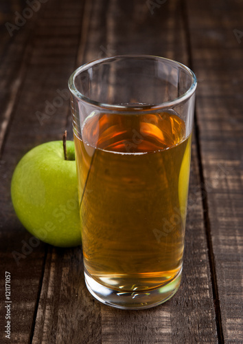 Apple juice glass with healthy green apples