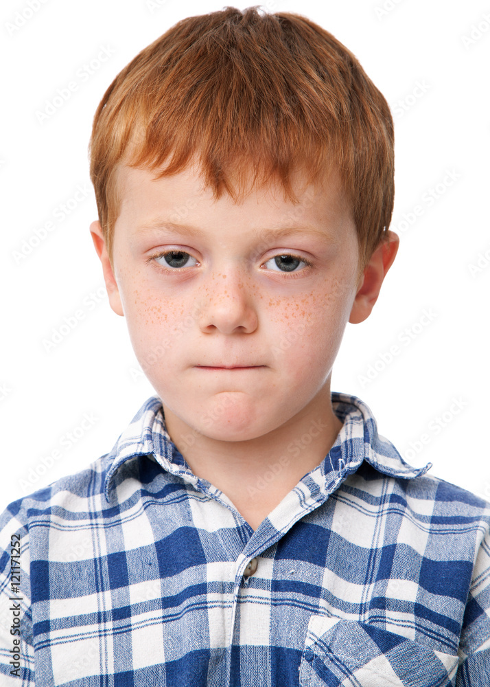 Little serious boy in checkered shirt, isolated on white background Little serious boy in checkered shirt, isolated on white background