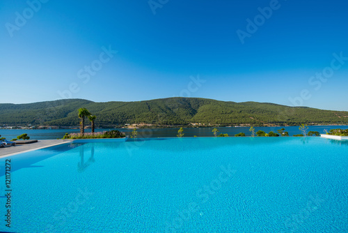 Nice swimming pool outdoors on bright summer day