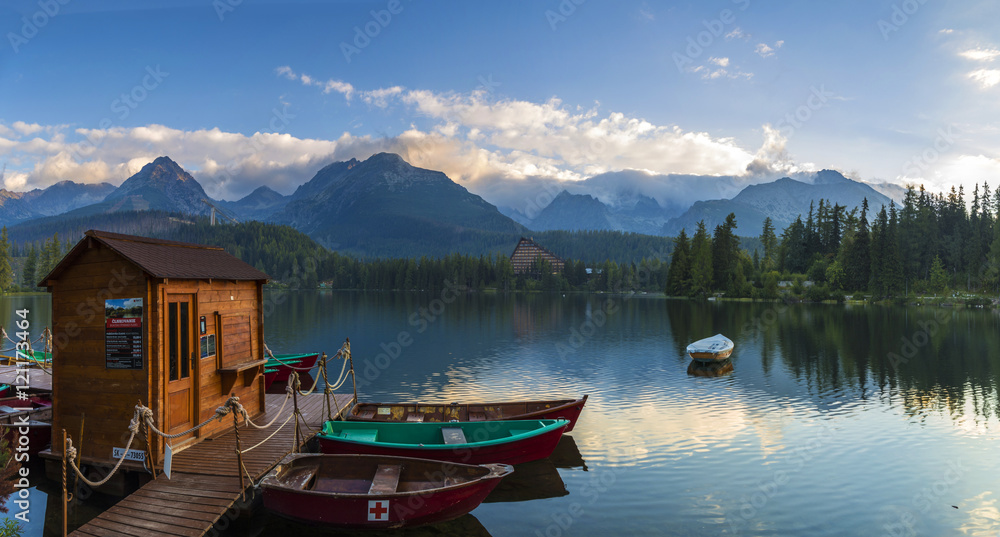 Boat on the dock surrounded mountains. Strbske Pleso High Tatras. Slovakia, Europe.