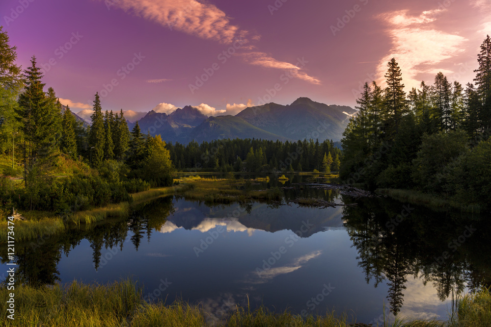 The sunrise over a lake in the park High Tatras. Strbske Pleso, Slovakia, Europe.