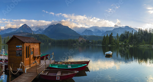 Boat on the dock surrounded mountains. Strbske Pleso High Tatras. Slovakia, Europe. © Matej Kotula