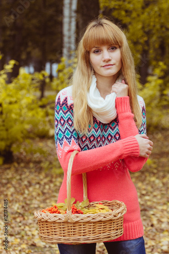 Fall concept - autumn woman holding basket in park © MaximBeykov