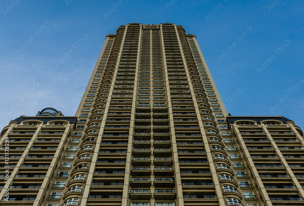 Fototapeta premium Skyscraper in Puerto Madero neighborhood in Buenos Aires against blue sky 