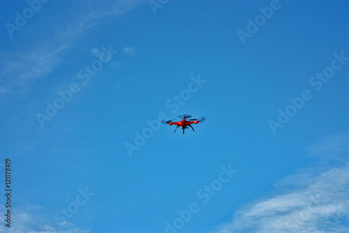 orange drone flight on the blue sky