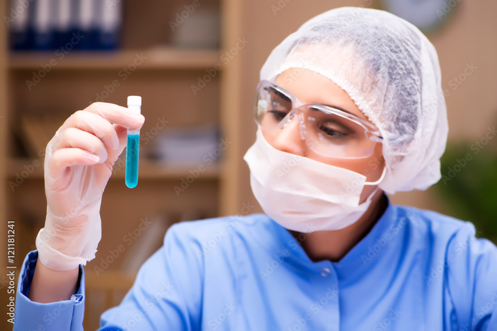 Lab chemist working with microscope and tubes Lab chemist working with microscope and tubes