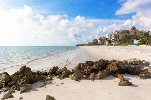 Amazing landscape in Naples beach, Gulf of Mexico, Southwest Florida, USA. Idyllic spot of the beach in this family vacation and relax spot. White sand and calm water.