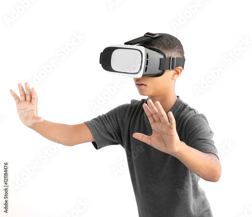 African-American boy wearing virtual reality glasses on white background