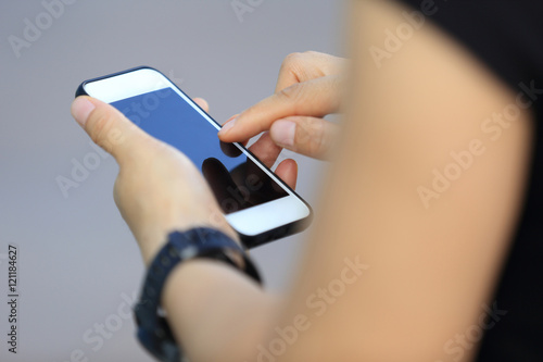 young woman use smart phone in modern city photo