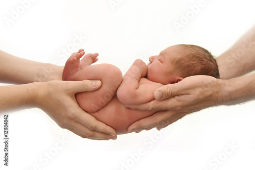 Little newborn baby boy girl in parents' hands isolated