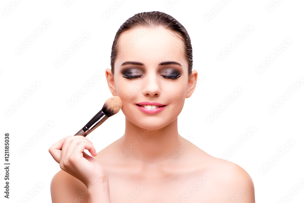 Young woman during make-up session isolated on white