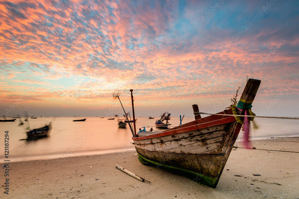 fishing boat used as a vehicle for finding fish in the sea.at sunset fishing boat used as a vehicle for finding fish in the sea.at sunset