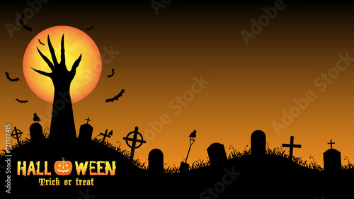 Halloween background with demon hand in graveyard 