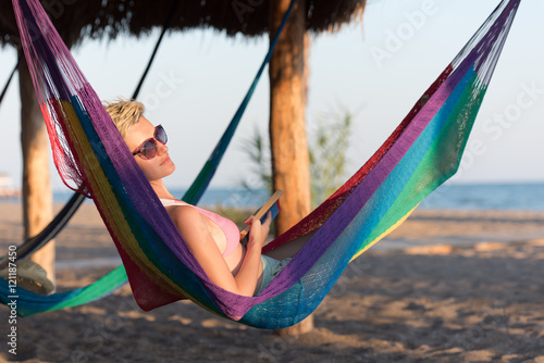 relaxed woman laying in hammock