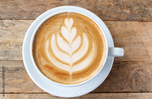 Cup of coffee latte art on wood table