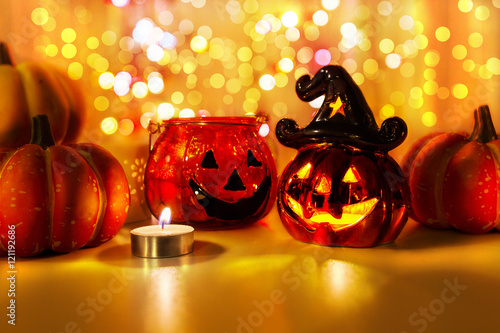 Halloween pumpkin with candlelight and bokeh background