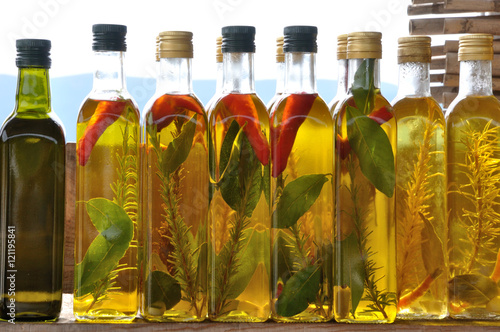 Butelki z oliwą z oliwek i przyprawami. photo