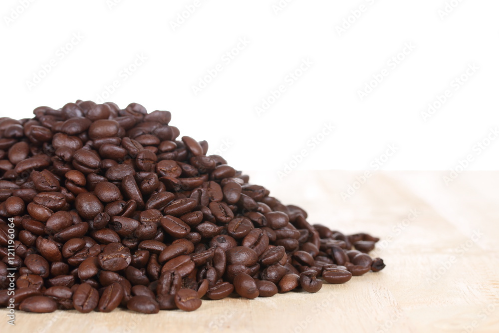 coffee beans on wood table coffee beans on wood table
