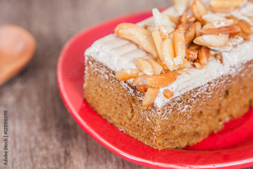 Coffee cake with cashew nut on wood table Coffee cake with cashew nut on wood table